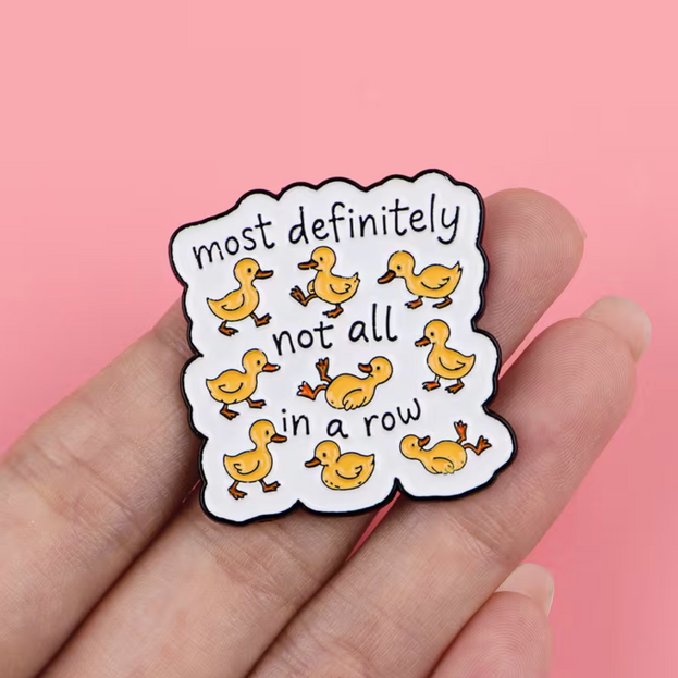 'Most definitely not all in a row' enamel Pin