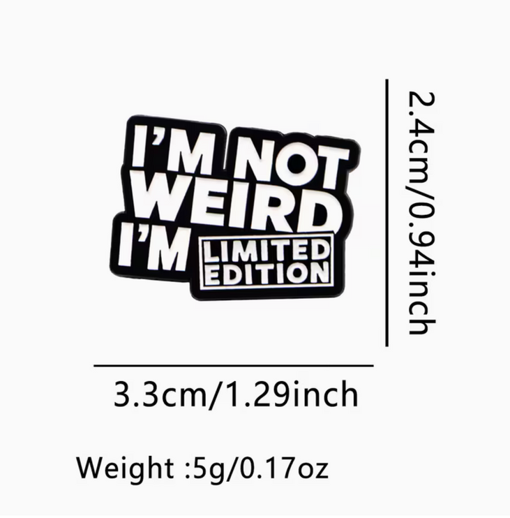 'I'm not weird I'm limited edition' black and white enamel Pin