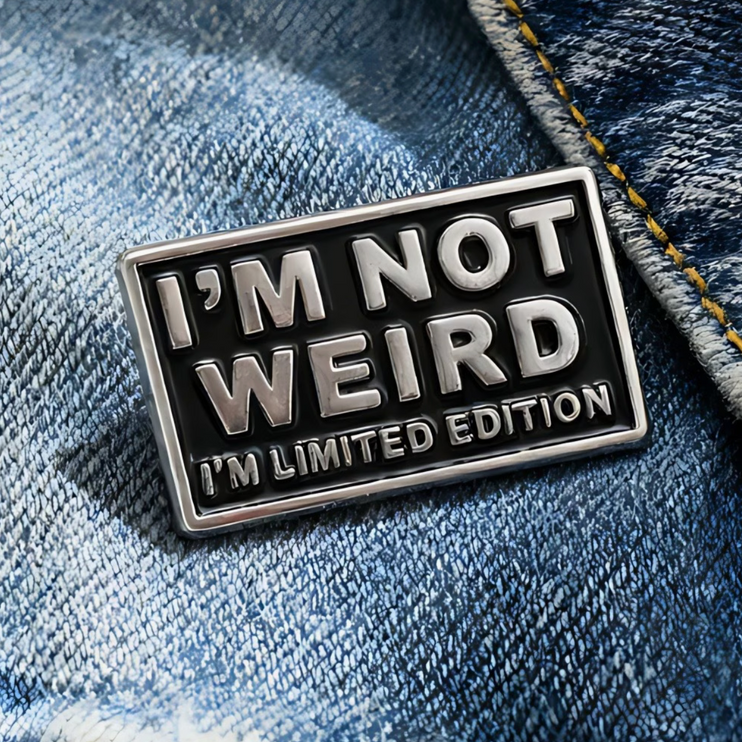 'I'm not weird I'm limited edition' silver and black enamel Pin